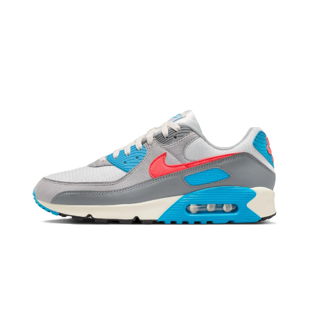 Grey low-top sneakers with blue panels, red swoosh, and visible Air sole