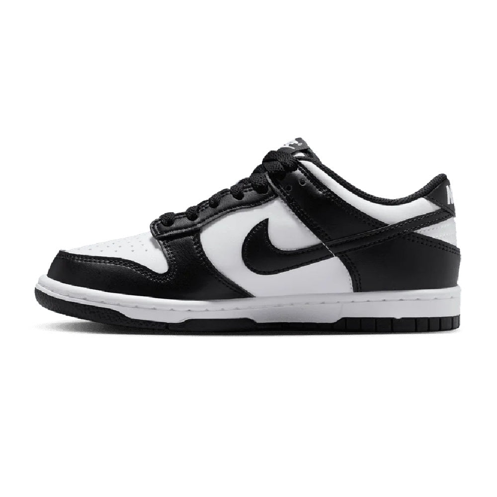 Kids' Nike Dunk Low sneakers in black and white, side profile with Swoosh