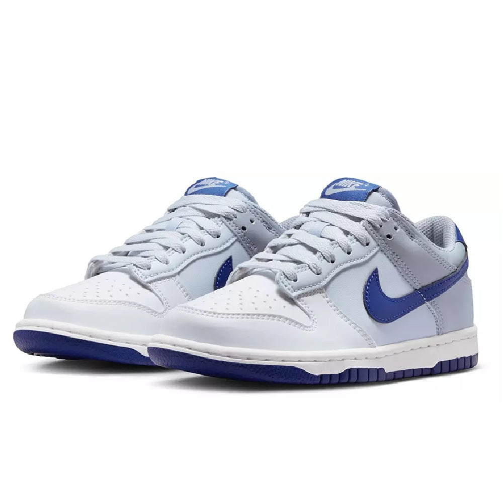 Pair of kids Nike Dunk Low sneakers, white leather with deep royal blue Swooshes