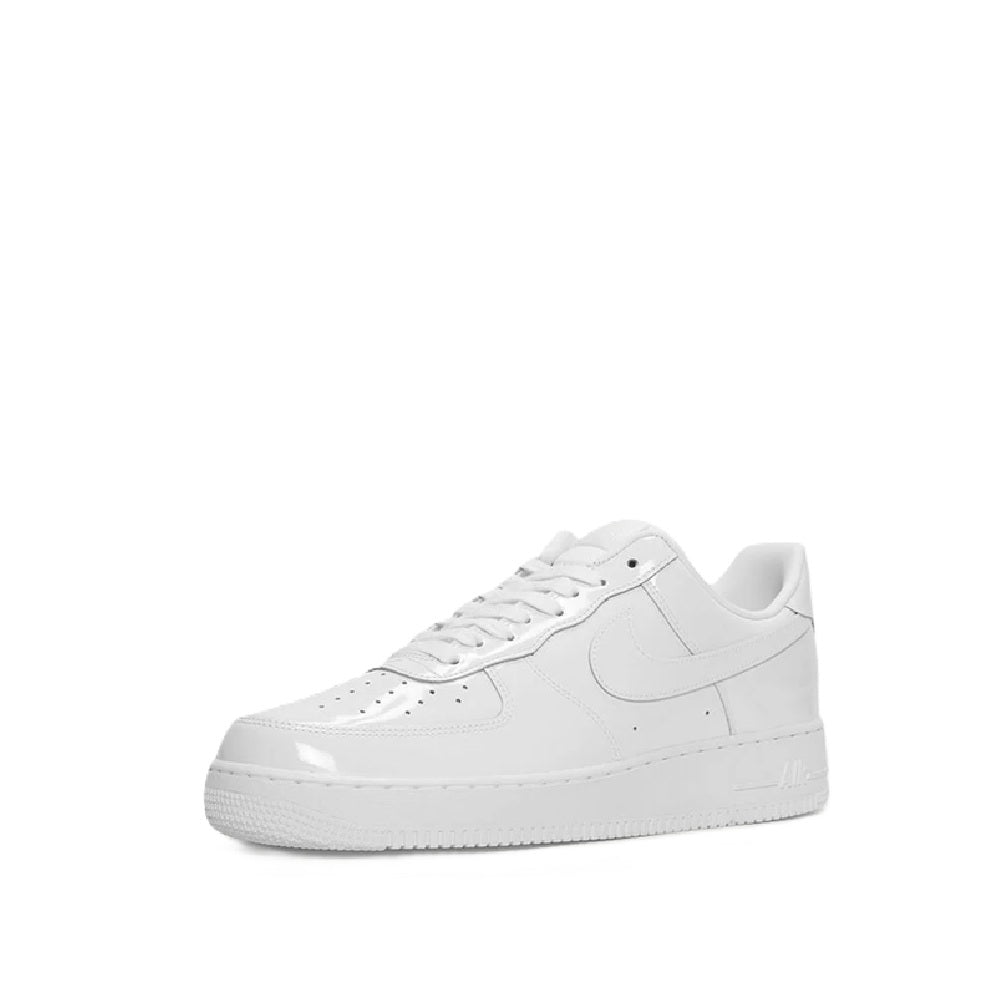 White Nike Air Force 1 PRM sneakers angled view, lace-up with perforated toe