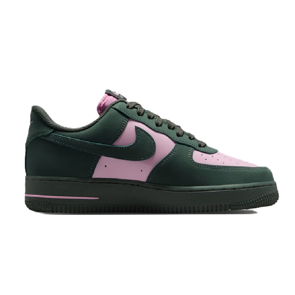 Green and pink low-top sneakers with swoosh logo and lace-up front
