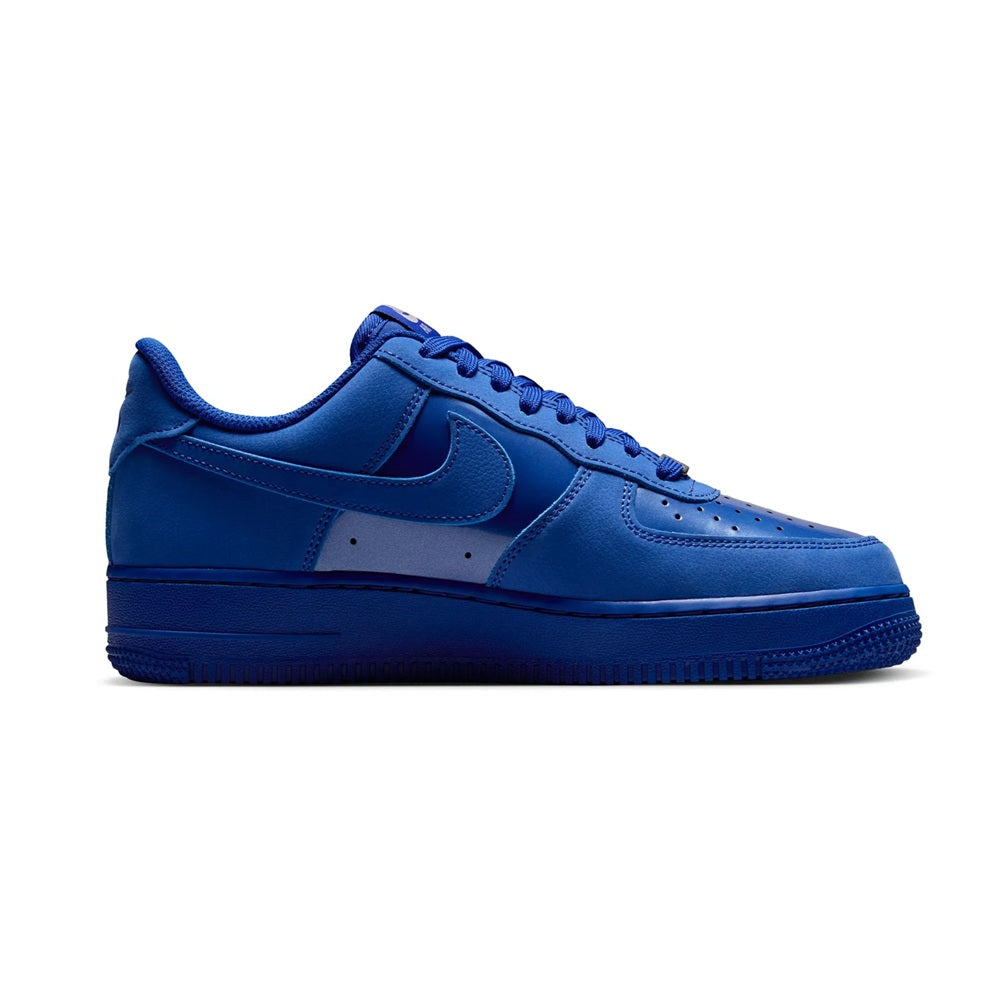 Women's Nike Air Force 1 low sneakers, royal blue side view with stitched panels