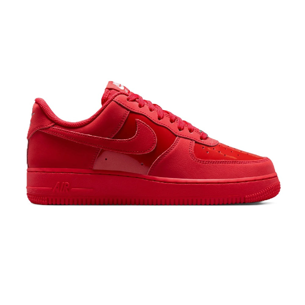 Red Nike Air Force 1 low-top sneakers with swoosh and lace-up front, padded tongue