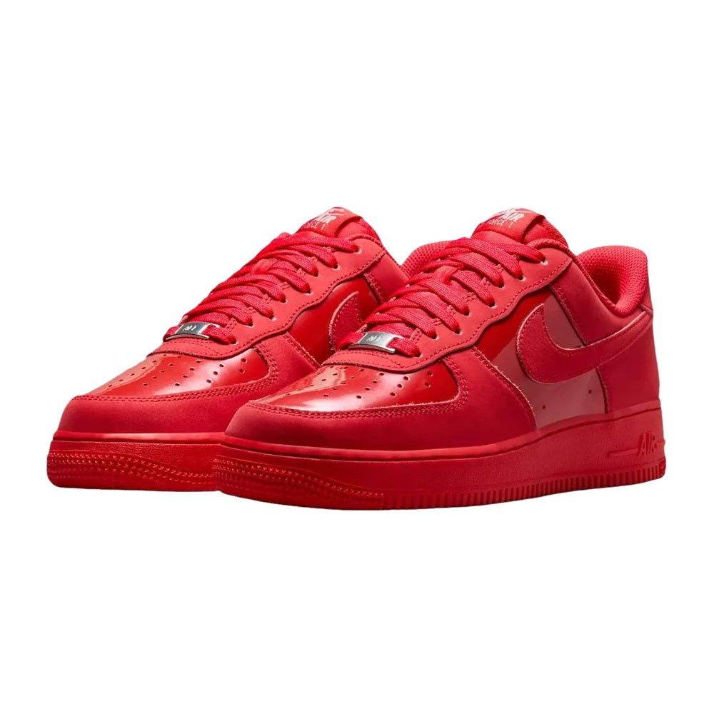 Pair of red Nike Air Force 1 low-top sneakers, front view with lace-up uppers