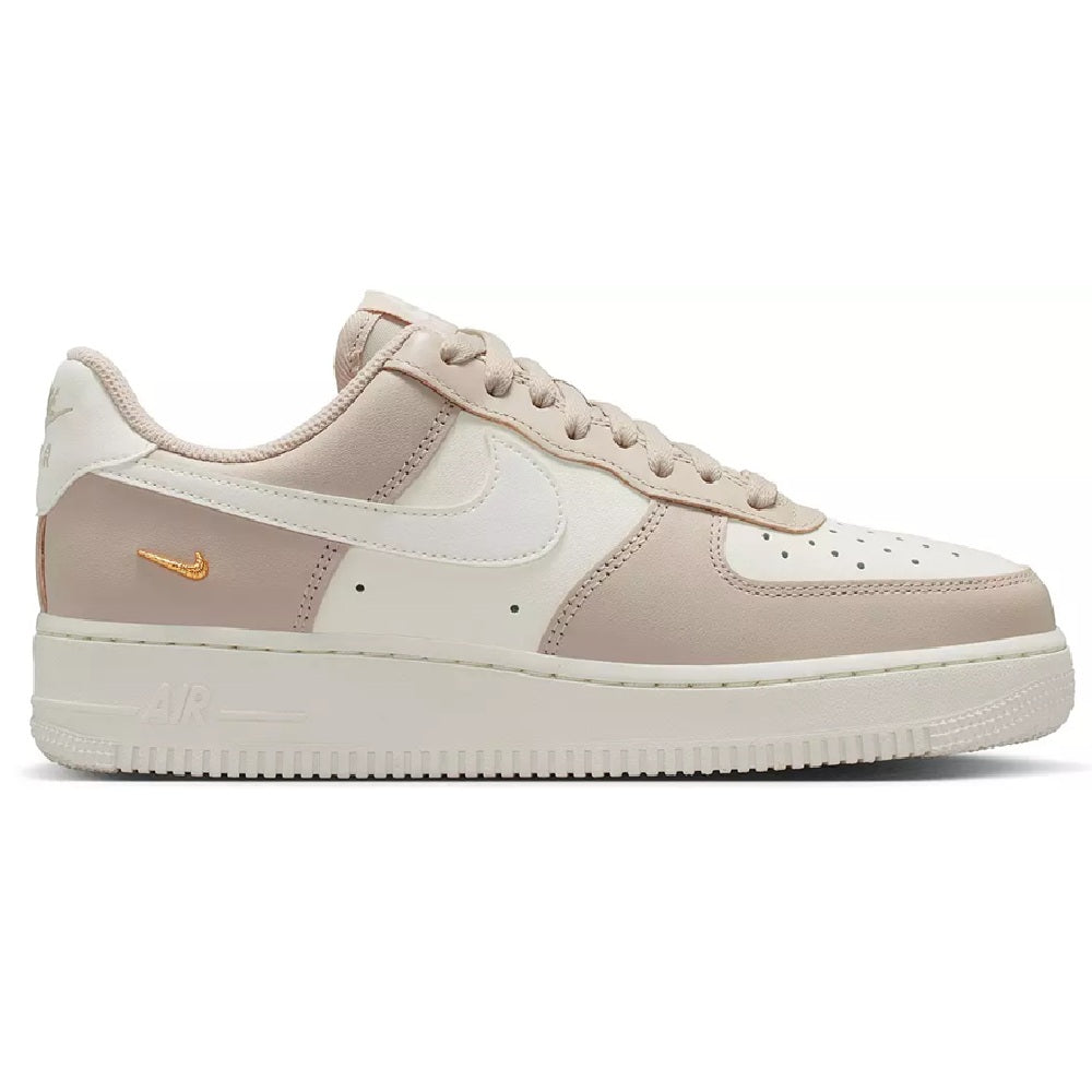 Nike Air Force 1 low sneakers in cream, beige overlays, gold swoosh, lace-up