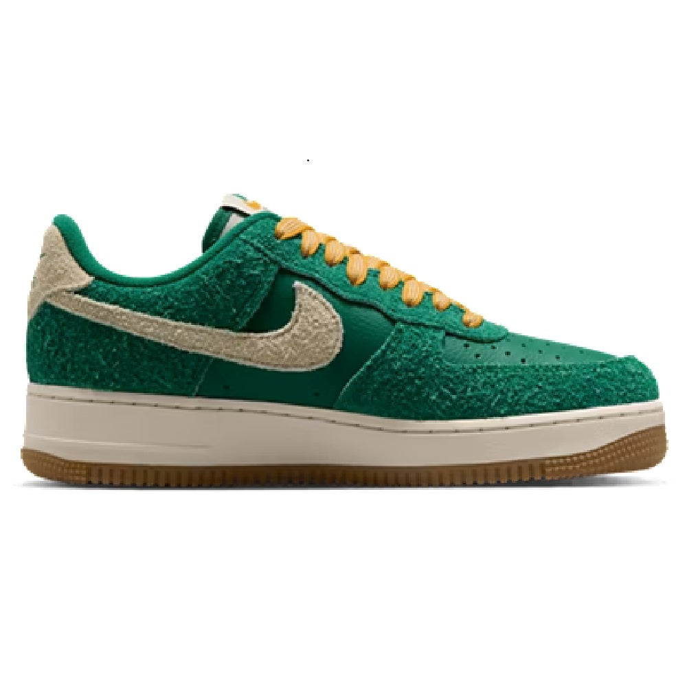Nike Air Force 1 low-top sneakers in green suede with silver swoosh, orange laces, gum sole