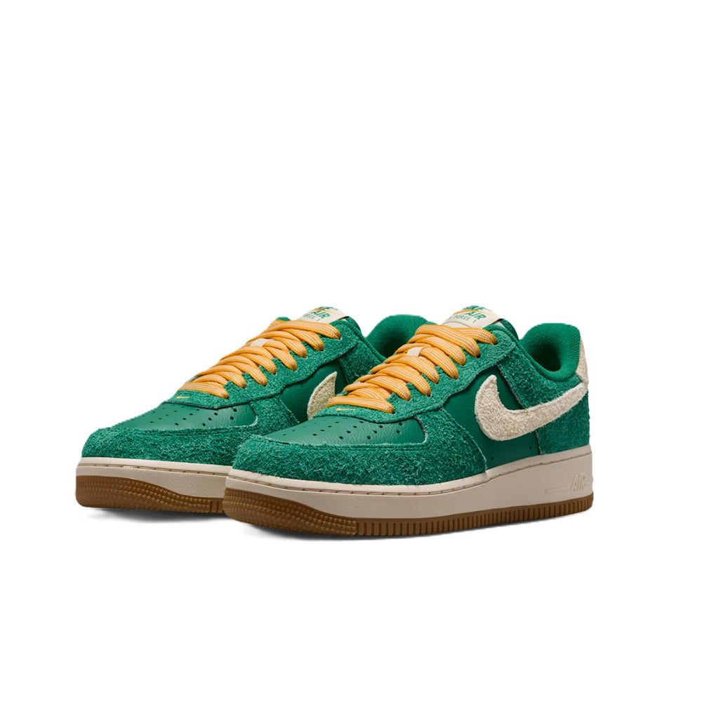 Nike Air Force 1 low-top sneakers, pair view in green suede with silver swoosh and orange laces