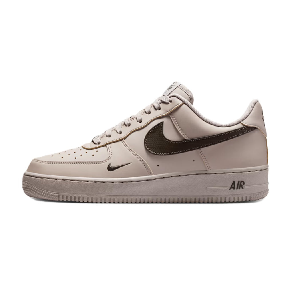 Nike Air Force 1 low-top sneakers, light gray and off-white, lace-up with Air logo