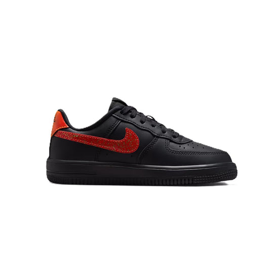 Kids' black low-top sneakers with red-orange Swoosh and lace-up front
