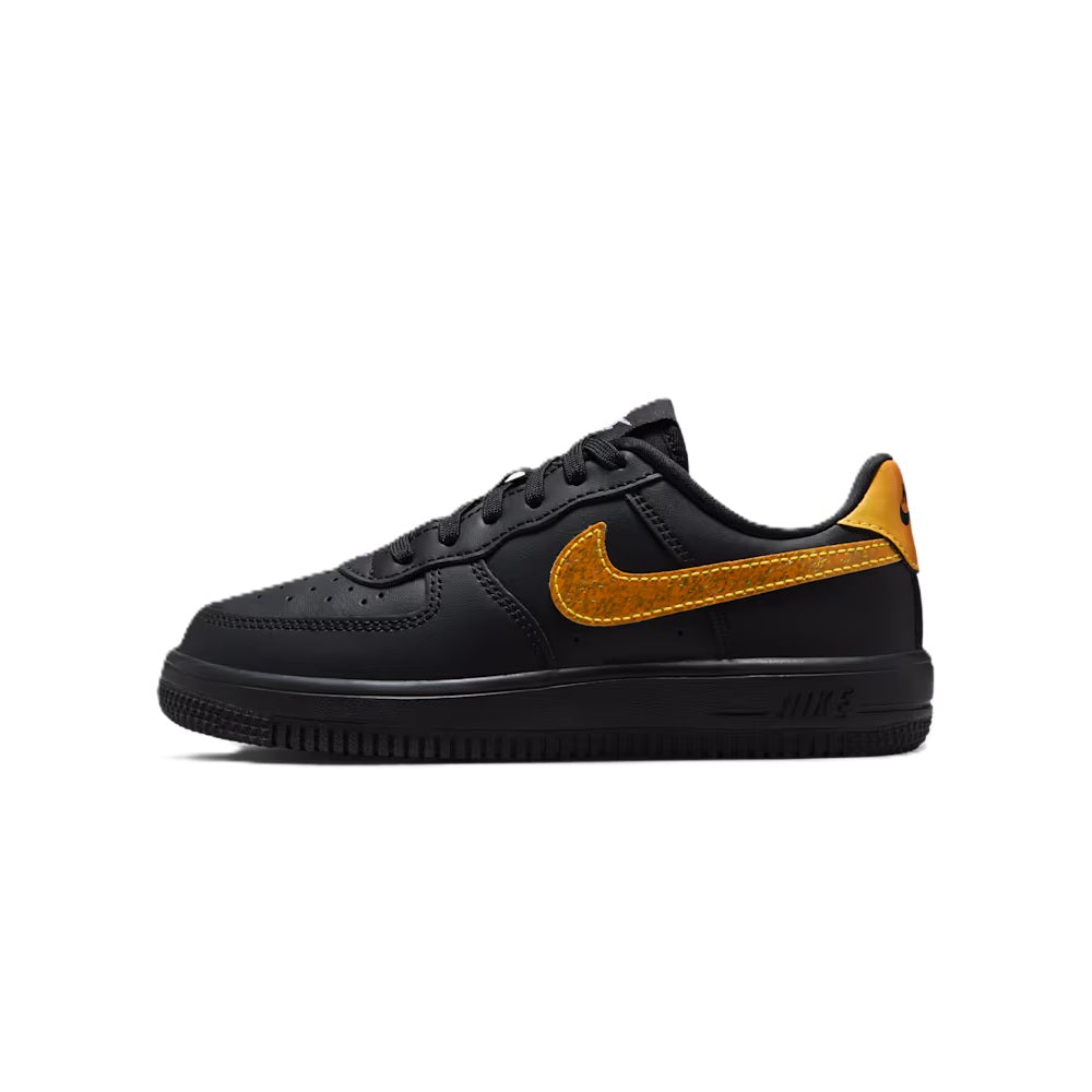 Kids' black low-top sneakers with gold-orange Swoosh and lace-up design