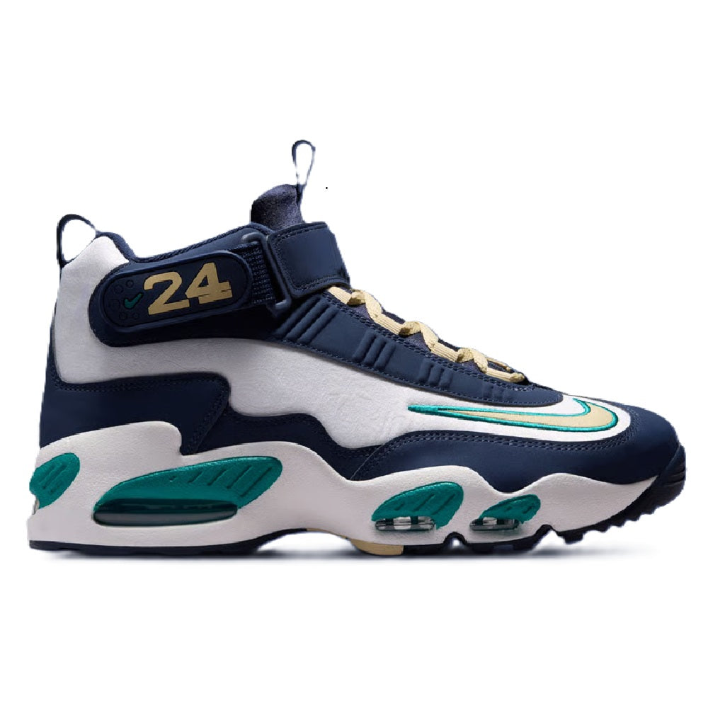 Midnight navy and white high-top sneakers with green accents and gold lace tips