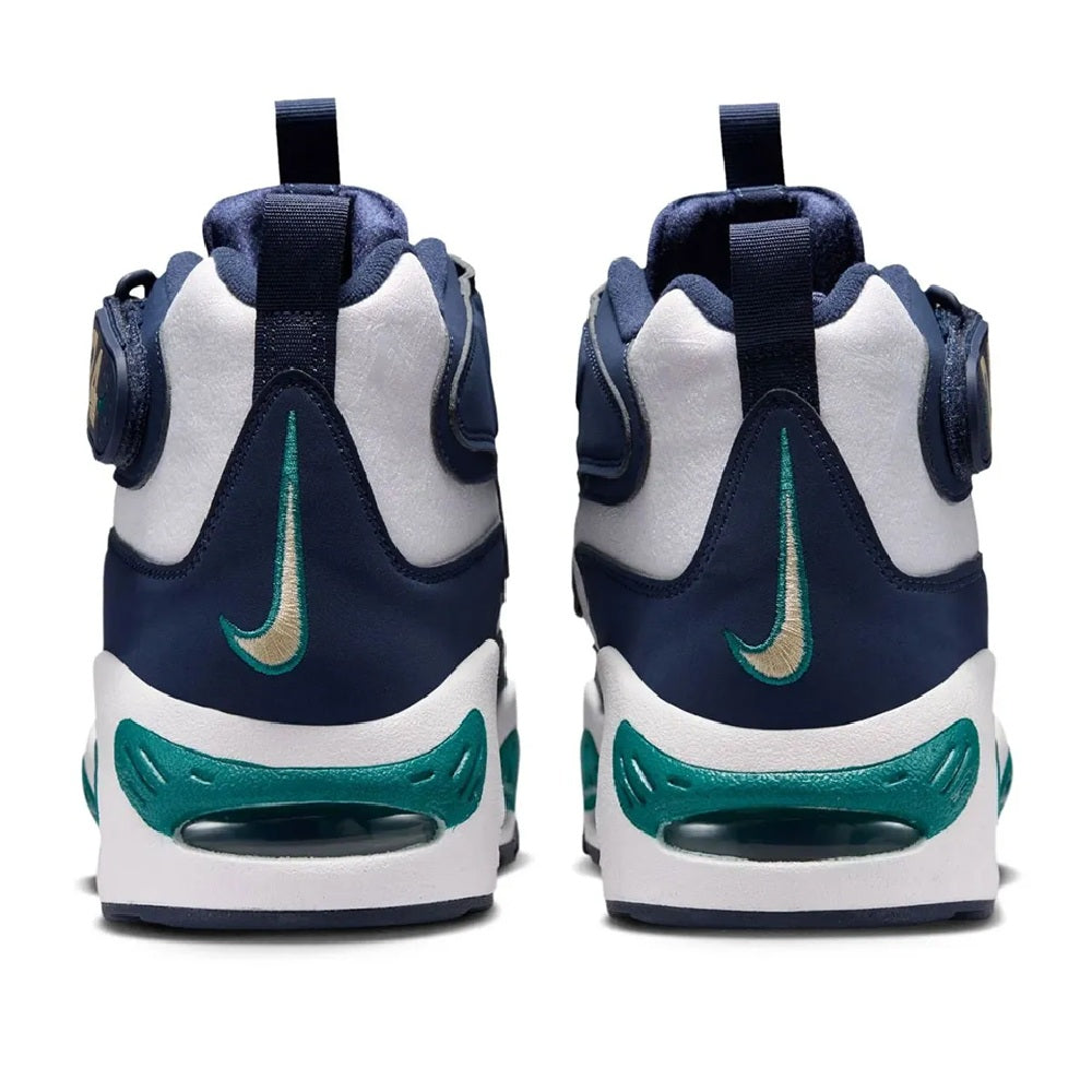 Back view of navy high-top sneakers with teal swoosh, white heel panel, and pull tabs