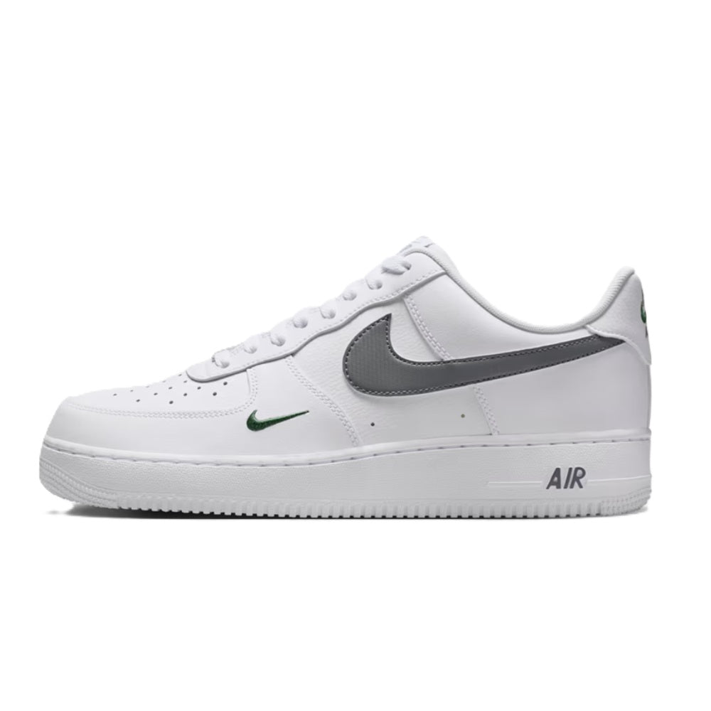 Nike Air Force 1 sneakers, white leather with dark gray swoosh and 'AIR' heel.