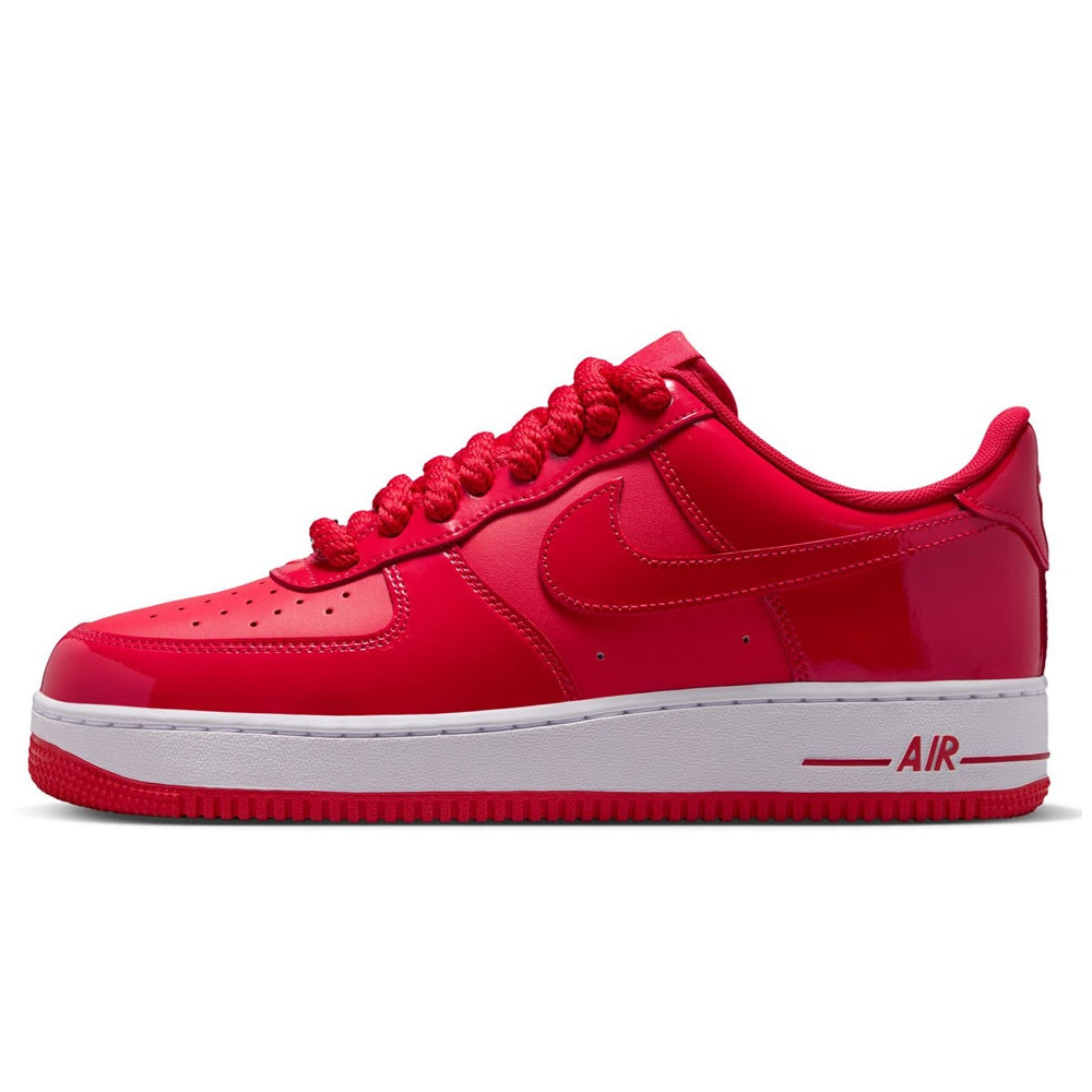 Red Nike Air Force 1 low-top sneakers with swoosh and “AIR” side branding, white sole
