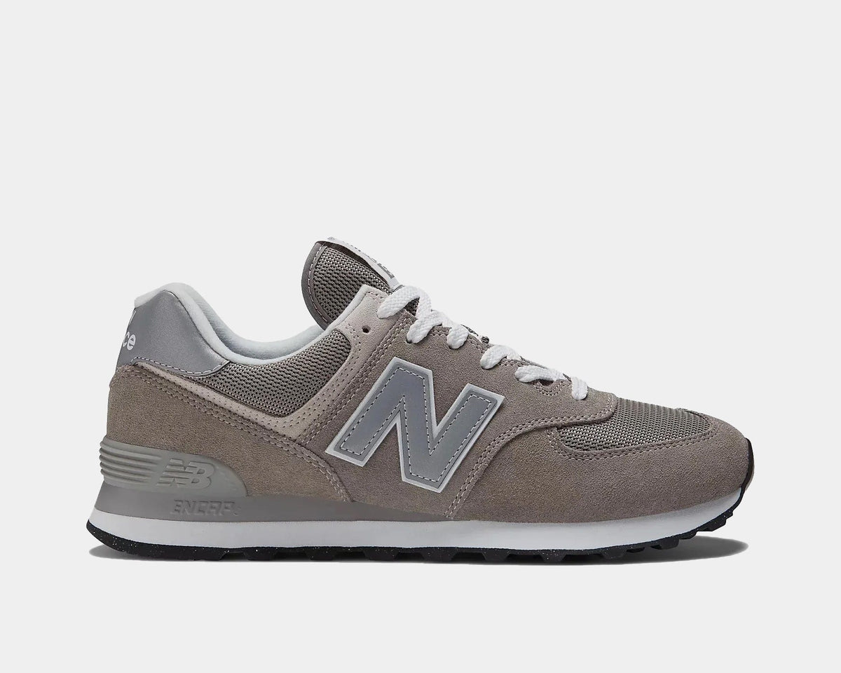 New Balance 574 sneakers in taupe/gray suede with gray laces, side view