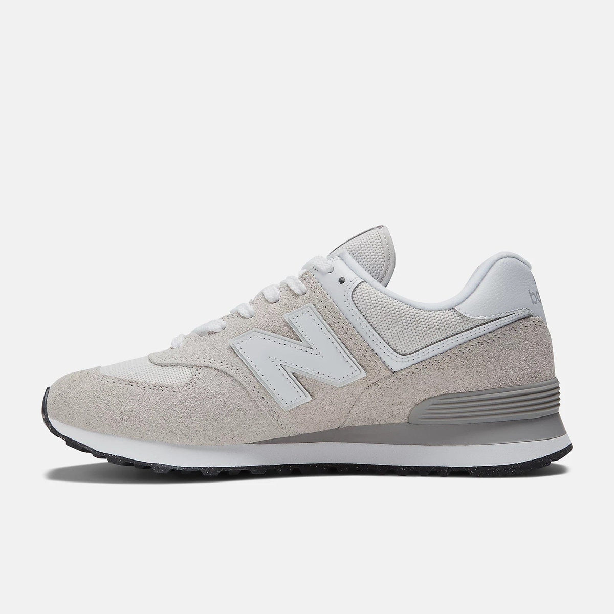 Light grey lace-up sneakers with suede overlays, white N logo, and grey sole