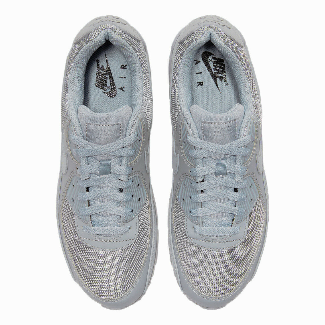 Air Max 90 sneakers inner view with light grey laces and Nike Air tongue label