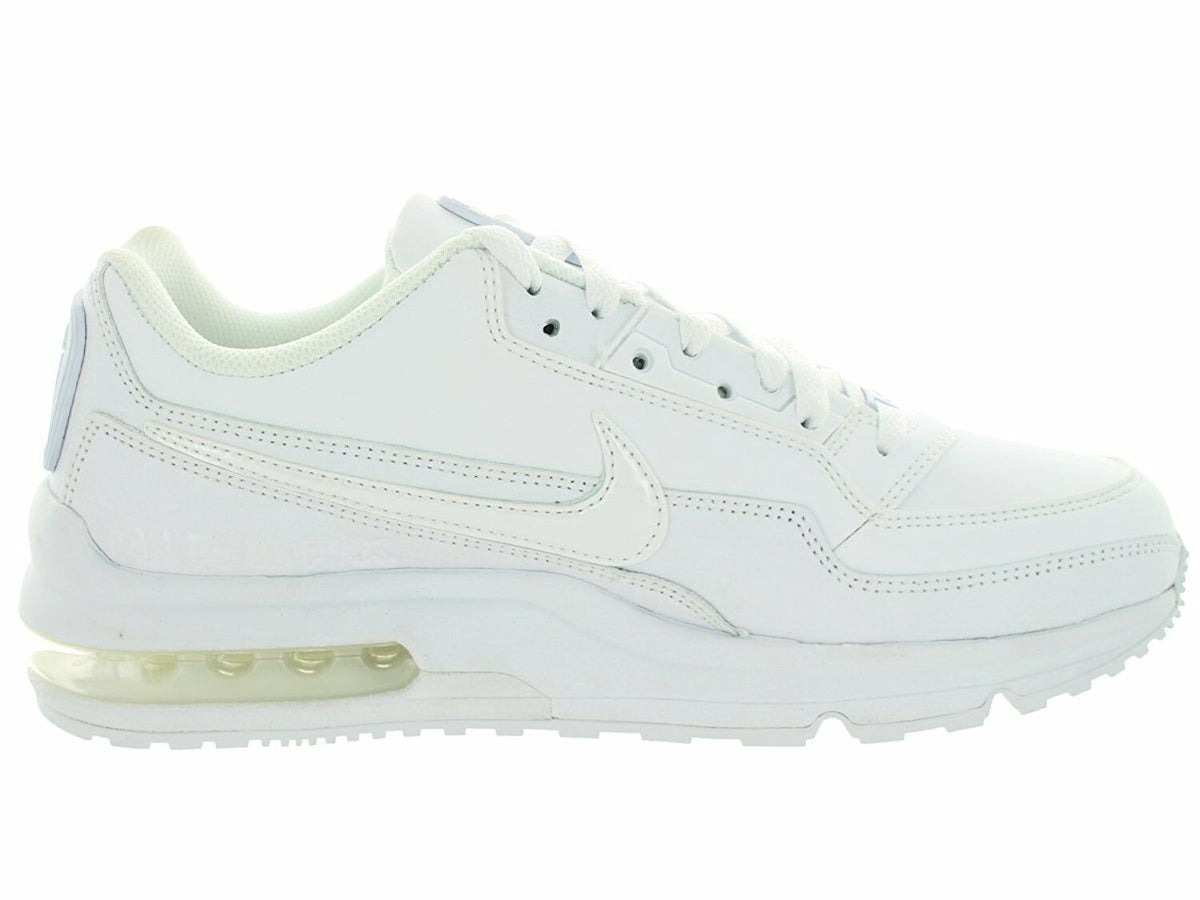White Nike low-top sneakers with side Swoosh logo and padded collar