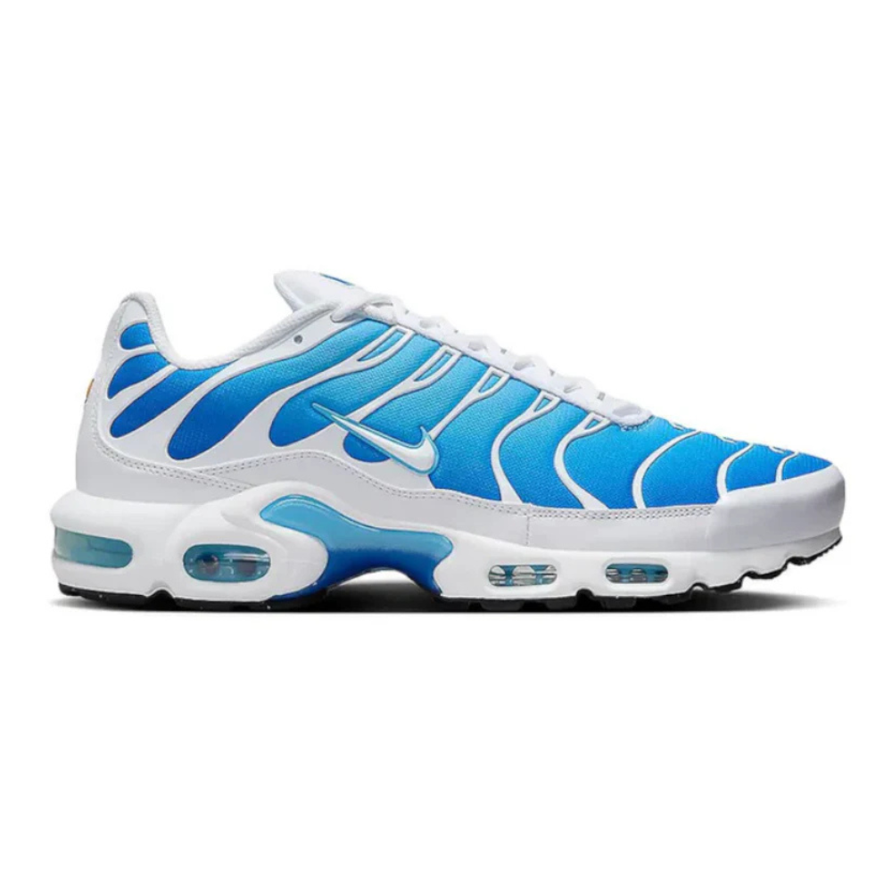 Nike Air Max Plus sneakers, white with blue patterned panels and visible Air unit soles
