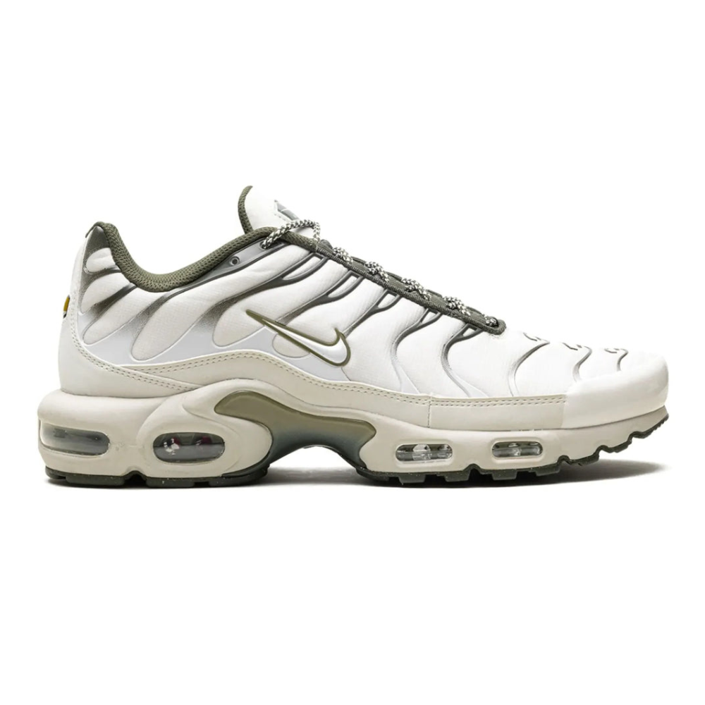 Nike TN Air Max Plus running shoe with white upper and olive accents, lace-up.