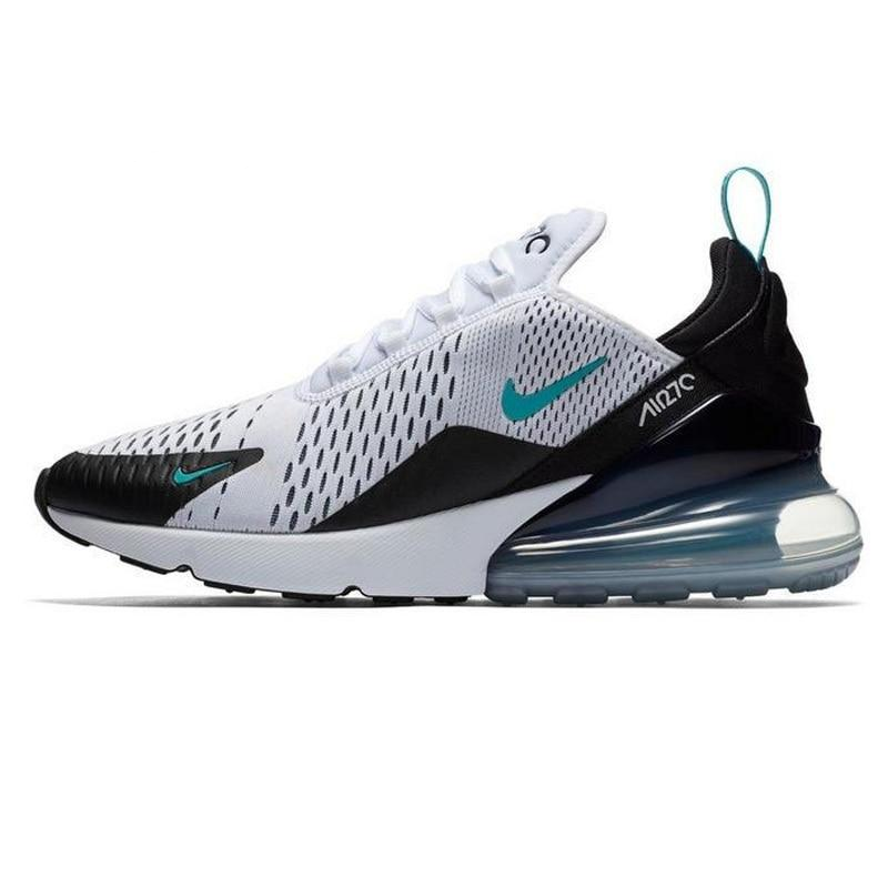 Running shoes with mesh upper, white and black, teal accents, visible air sole unit.