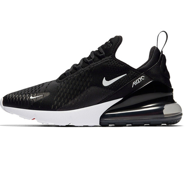 Running shoes with mesh upper, black with white midsole, visible air sole unit.