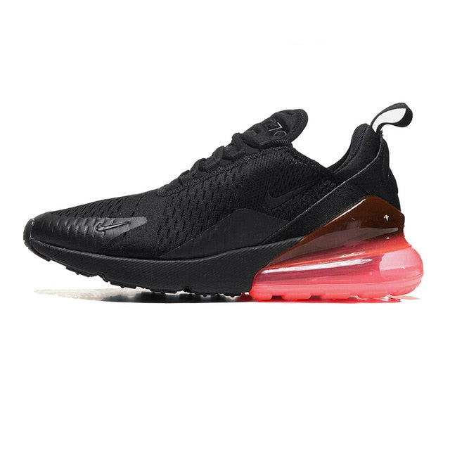 Running shoes with mesh upper, black with red air sole unit, dark heel collar and laces.