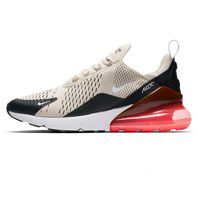 Running shoes with knit upper, light beige and black, bright red air sole unit.