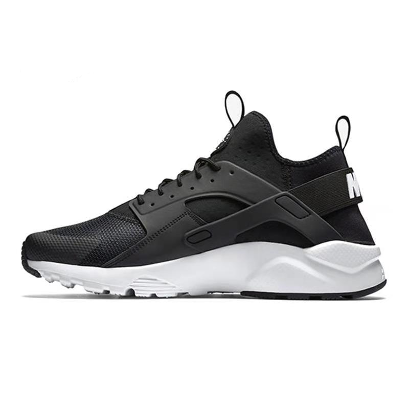 NIKE running shoe in black with white midsole and tread