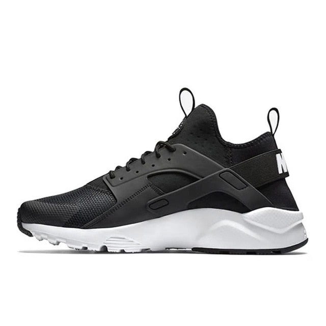 NIKE running shoe in black with white midsole and side straps
