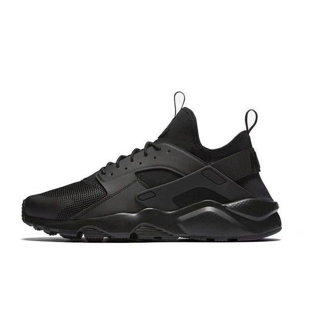 NIKE running shoe in black with chunky dark midsole and rubber outsole