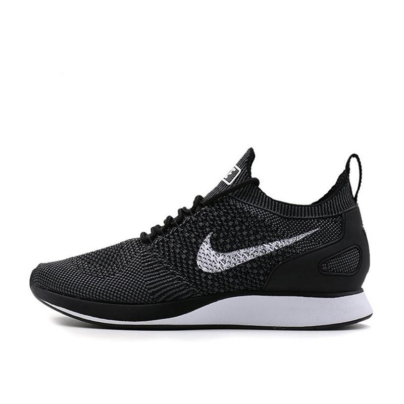 Black knit running shoe with Nike swoosh, lace-up, white midsole