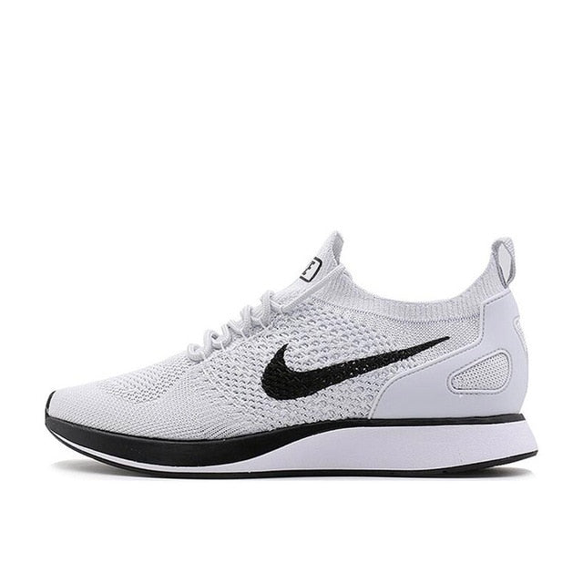 White knit running shoe with black Nike swoosh, lace-up, black heel panel