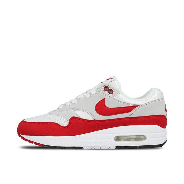 Nike Air Max 1 running shoe, white with red swoosh and red side panels