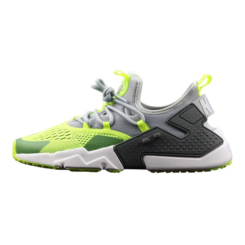Air Huarache running shoes in neon green, gray, and black with lace-up and white sole