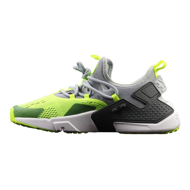 Air Huarache running shoes in neon green and black with lace-up, gray collar, and white midsole