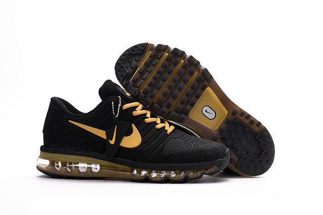Black and gold running shoes with Nike swoosh and Air-style clear cushioning outsole
