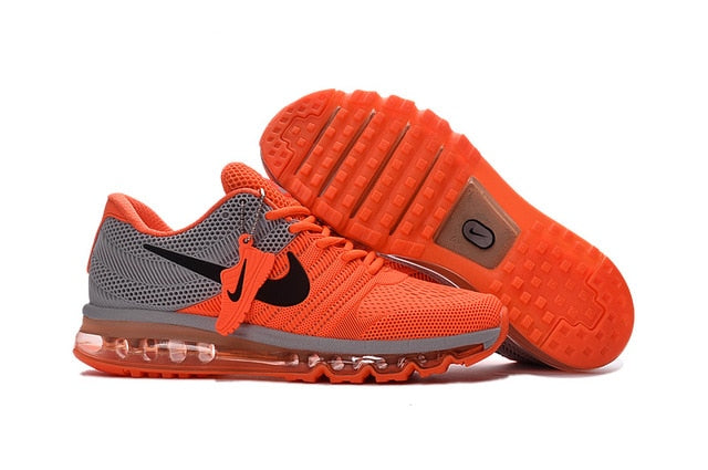 Orange running shoes with Nike swoosh and Air-style clear cushioning outsole tread