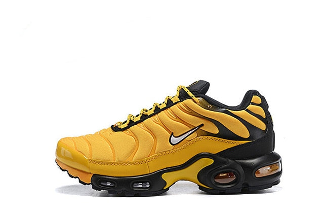 Yellow and black running shoes, side view, Nike swoosh with Air Max cushioning