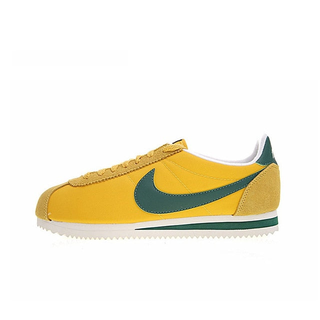 Nike Cortez low-top running shoe with yellow upper and green swoosh