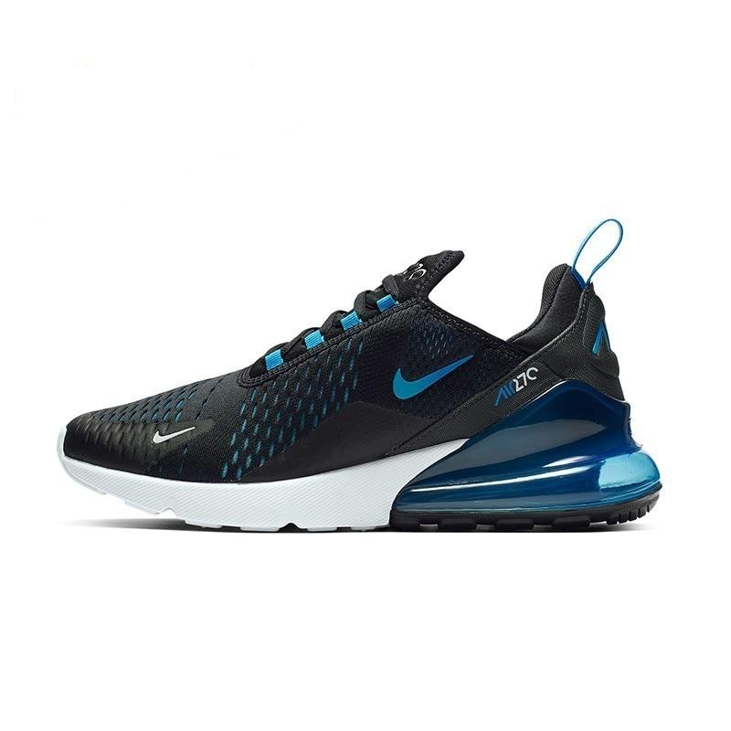 Black running shoes with blue accents, Nike swoosh, visible Air Max-style heel unit