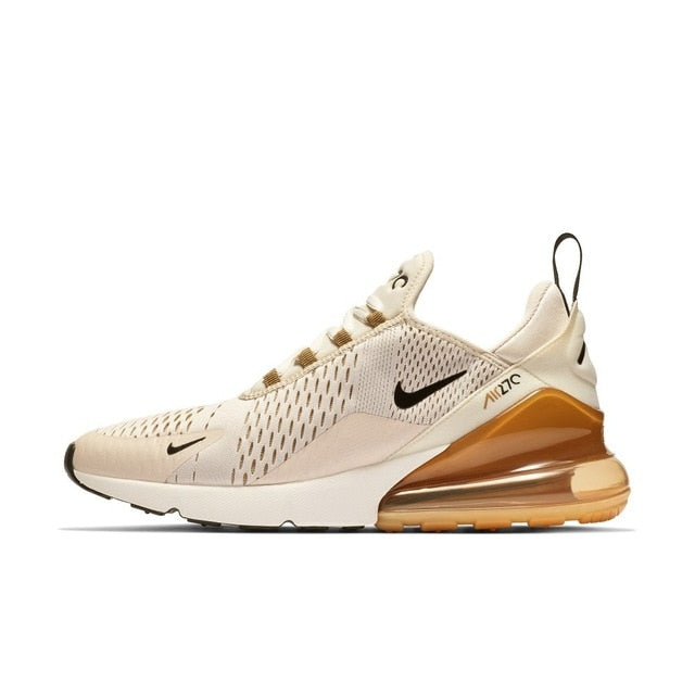 Beige running shoes with tan heel unit, Nike swoosh, breathable mesh upper
