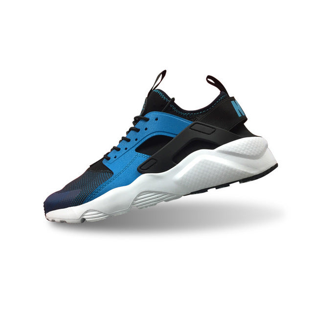 Nike Air Huarache running shoes in blue with black overlays and white sole