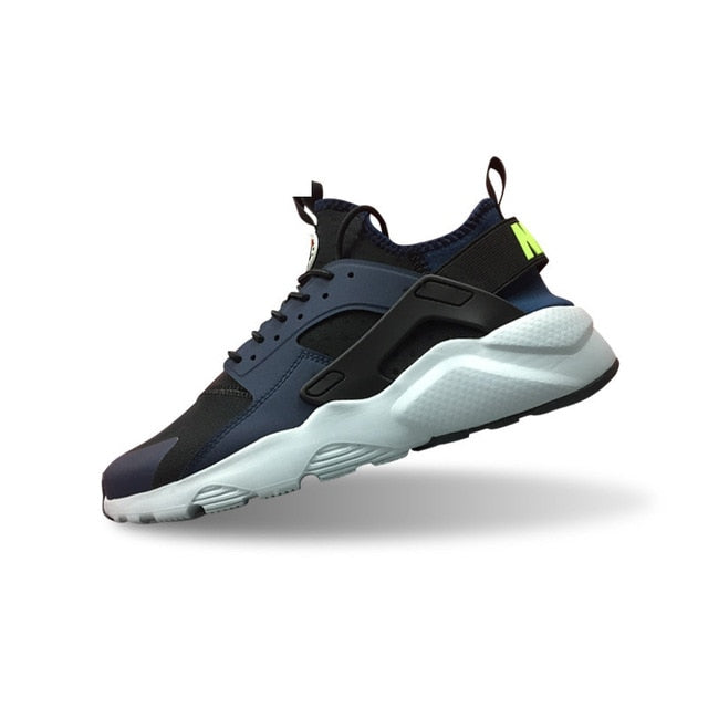 Nike Air Huarache running shoes in dark blue with black strap and light green detail