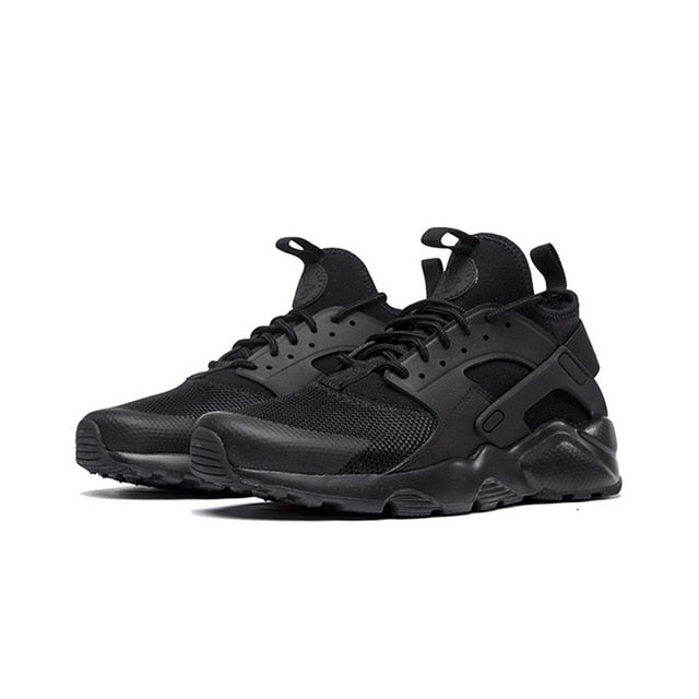 Nike Air Huarache running shoes in black with textured panels and white midsole