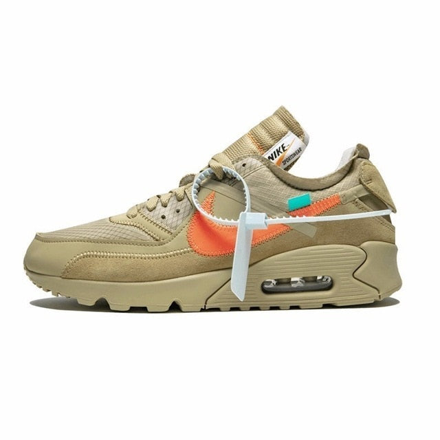 Tan Nike running shoe with orange swoosh, teal lace accents, air-cushioned sole and knit upper