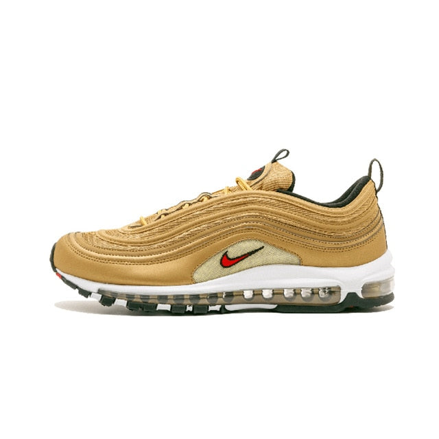 Air Max 97 running shoes in tan with red swoosh and black tread sole
