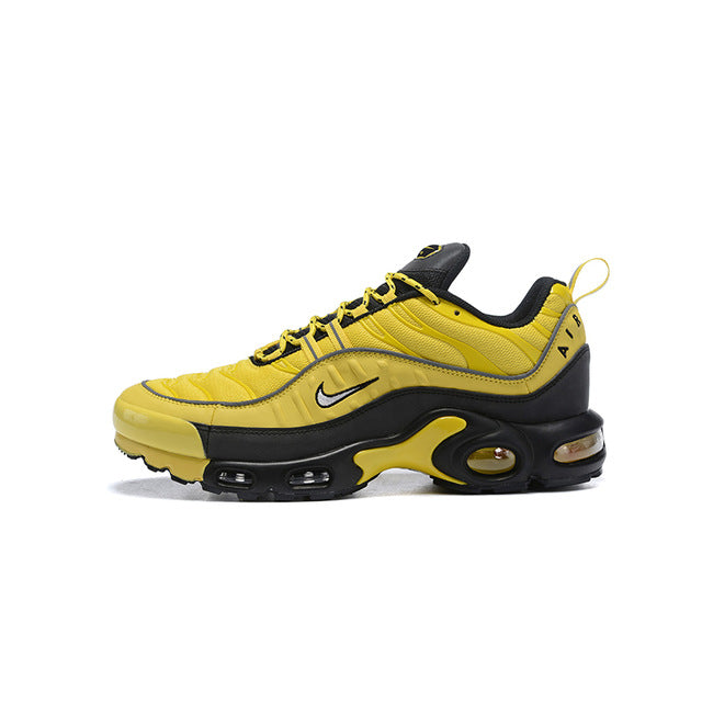 Yellow and black running shoes with lace-up front and visible Air unit