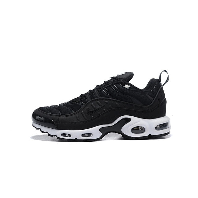 Black running shoes with white accents, lace-up design, and Air unit window