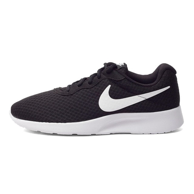 Dark brown mesh lace-up running shoe with white Swoosh and cushioned sole.
